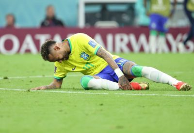 LUSAIL CITY, QATAR - NOVEMBER 24:  Neymar JR of Brazil goes down injured during the FIFA World Cup Qatar 2022 Group G match between Brazil and Serbia at Lusail Stadium on November 24, 2022 in Lusail City, Qatar. (Photo by Jean Catuffe/Getty Images)